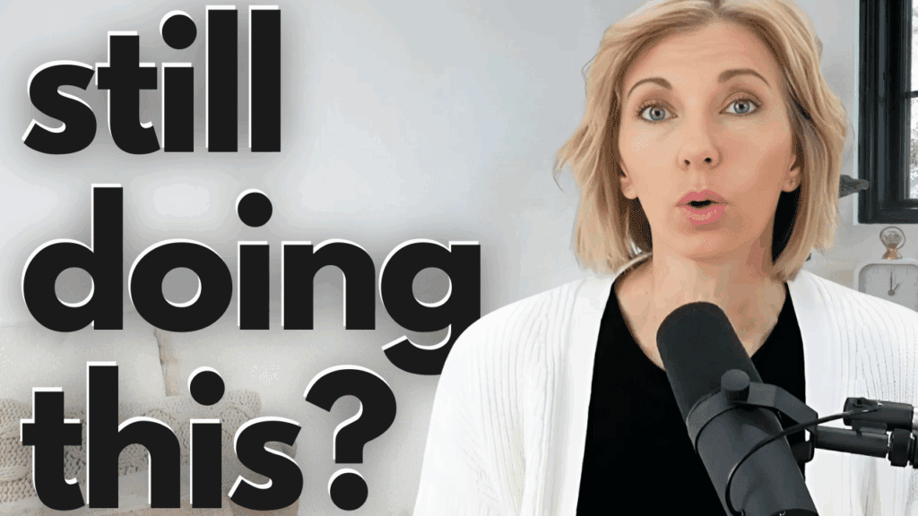Host in a black blouse and white sweater jacket in front of a microphone with the text, "still doing this?" 